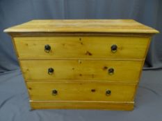 STRIPPED PINE CHEST OF THREE LONG DRAWERS with ring pull handles, 81cms height, 108cms width, 46.