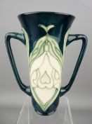 MOORCROFT - a twin handled Snowdrop vase by the Moorcroft Collector's Club, Marked 567WM to the