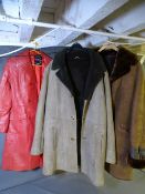 TWO VINTAGE SHEEPSKIN COATS and a red leather effect coat