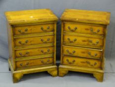 PAIR OF REPRODUCTION YEW WOOD CHESTS OF FOUR DRAWERS on corner bracket feet, 62cms height, 45.5cms