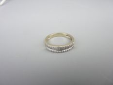 18CT WHITE GOLD & DIAMOND HALF ETERNITY RING, 0.33 collective carat estimate of channel set baguette