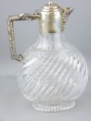 SILVER MOUNTED SPIRAL GLASS CLARET JUG, London 1887, maker Edward Hutton, the leaf scroll handle