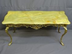 ONYX TOP GILT BRASS RECTANGULAR COFFEE TABLE with mask corners on shaped supports, 49cms height,