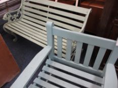 GARDEN BENCH with cast iron ends and lion head arms and a similar painted wooden chair