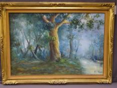 MODERN GILT FRAMED OIL ON CANVAS of a woodland scene, indistinct artist's signature, 48 x 88.5cms