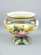 ROYAL WORCESTER - a glazed circular bowl on a shaped scroll decorated pedestal and having a