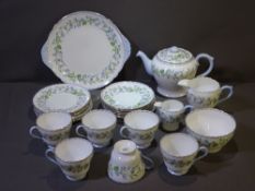 TWENTY-THREE PIECE 'SHELLY' BONE CHINA TEA SERVICE comprising six cups, saucers and plates, sandwich