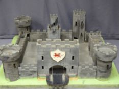 A SECTIONAL MODEL CASTLE ON A PLATFORM BASE, 28cms maximum height, 66 x 71cms base