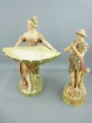 TWO ROYAL DUX PORCELAIN FIGURINES of a shepherd boy with pan pipes and a lamb at his feet, impressed