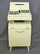 A NEW WORLD CADET VINTAGE GAS COOKER in cream enamel, 101cms height, 45cms width, 44cms depth