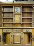 CONTINENTAL OAK CLOCK DRESSER with central 10in square brass dial with silver chaptering set with