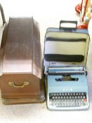 VINTAGE CASED HAND CRANK SEWING MACHINE and an Olivetti cased typewriter