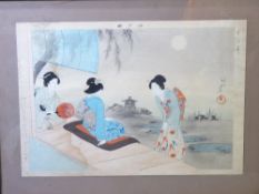 AN EARLY 20TH CENTURY JAPANESE WOOD BLOCK PRINT of three women in traditional dress within a