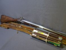 ANTIQUE DOUBLE BARREL MUSKET RIFLE, fishing rods, other fishing equipment and a boxed gun cleaning