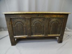 EIGHTEEENTH CENTURY OAK LIDDED CHEST, joined oak construction, the three panel front with carved