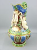 A 19TH CENTURY MINTON MAJOLICA PITCHER/JUG showing a cherubic figure held aloft by a merman and