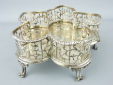 SILVER BOTTLE STAND of attractive pierced form to hold five bottles and standing on five double ball