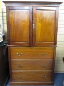 CIRCA 1900 MAHOGANY PRESS CUPBOARD of twin top doors and interior slide out trays over a three