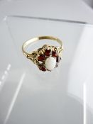 DRESS RING, centre opal and garnet cluster, R fit, 2.4gms (one missing garnet)