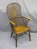 CIRCA 1830 ELM WINDSOR ELBOW CHAIR with pierced splat and spindle back on a H stretcher, 11cms H,