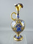 BELIEVED COALPORT GILT GROUND BLUE FLORAL DECORATED NARROW NECKED SINGLE HANDLED JUG, 19cms H