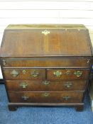 GEORGIAN CROSS-BANDED WALNUT FRONT BUREAU with interior slide open well and fitted drawer, pigeon