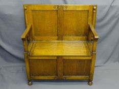 POLISHED MONKS BENCH with carved front detail, 84cms W