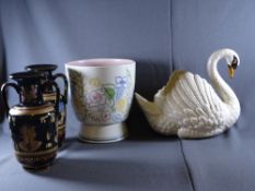 DARTMOUTH SWAN PORCELAIN CENTREPIECE, Poole style planter and a pair of pharaoh themed vases