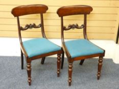 PAIR OF REGENCY MAHOGANY SIDE CHAIRS, curved crest rail and rear sabre leg, carved central rail