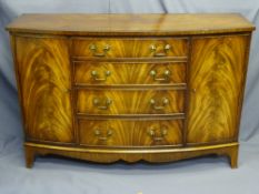FINE BOW FRONTED MAHOGANY SIDEBOARD with four central drawers flanked by two cupboard doors,