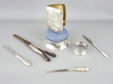 SILVER PARCEL - a lady's cigarette case, napkin ring, circular based pin cushion, three silver