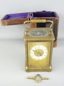 VINTAGE BRASS CASED CARRIAGE CLOCK with white enamel dial set with roman numerals with winding