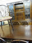 WELL PRESENTED REPRODUCTION OAK DINING SUITE of rectangular table, six (four plus two) wheelback