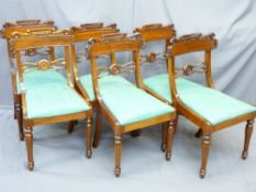 SET OF SIX REGENCY STYLE MAHOGANY DINING CHAIRS with carved crest and central rail detail and drop-