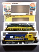 LIONEL ELECTRIC TRAINS O'GAUGE - two boxed engines, Santa Fe livery U36B, Cab No 8755 and a Seaboard