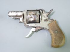 BLANK FIRING SIX SHOT STARTING REVOLVER with chrome plated body and hatched wooden grip, 12cms L