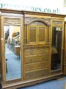 SUBSTANTIAL CIRCA 1900 OAK COMBINATION WARDROBE with Art Nouveau carved detail and architectural