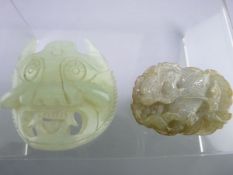 CARVED JADE PENDANT, 5cms, depicting a mythical beast amongst waves and carved jade belt mask, 5.