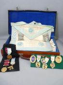 LEATHER CASE OF MASONIC REGALIA & JEWELS including hallmarked silver and enamel decorated