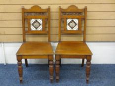 TWO EDWARDIAN OAK INSET TILE BACK HALL CHAIRS, 87cms H, 43cms W, 38cms D
