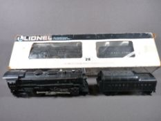 LIONEL ELECTRIC TRAINS O'GAUGE - a boxed Rock Island 0-4-0 locomotive and tender, Cab No 673 and