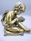 LATE 19TH CENTURY POLISHED BRONZE FIGURE of a young scribe seated upon a tasselled cushion, 16cms H