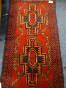 BALUCHI RUG - double block stylized pattern on a red ground with a cross pattern border, 145 x