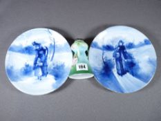 SILVER COLLARED ROSE PAINTED VASE, 11.5cms H and a pair of Royal Doulton display plates