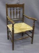 CHILD'S VINTAGE RUSH SEATED ARMCHAIR with spindle gallery back, 68cms H, 39cms W, 33cms seat D