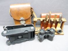 PIPE RACK with four pipes, a vintage cased Kodak camera and a cased set of Oldfield binoculars