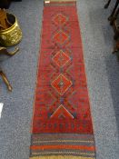 MESHWANI RUNNER - red ground with repeating central diamond pattern and bordered edge, 246 x 60cms