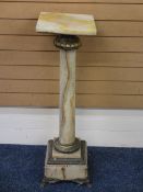 VINTAGE ONYX & BRASS COLUMN STAND on a stepped square base with paw feet, 102cms H