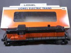 LIONEL ELECTRIC TRAINS O'GAUGE - a boxed Milwaukee Road R8-3 diesel engine in orange and black