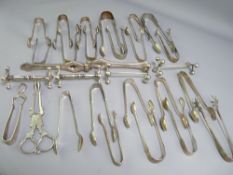CLAW & OTHER EPNS SUGAR TONGS, two pairs of knife rests and a set of table nut crackers